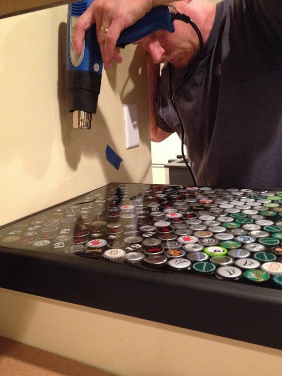 16-guy_makes_an_awesome_bottle_cap_bar_top