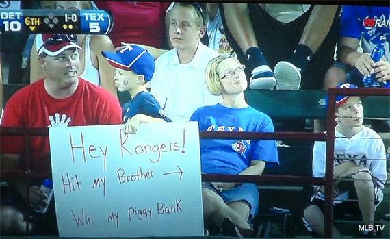 Holding-Funniest-Sports-Signs