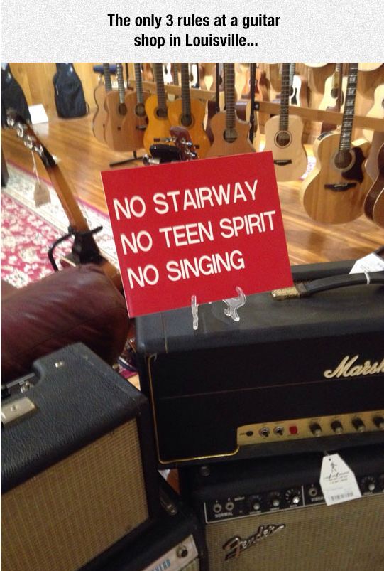 funny-guitar-shop-sign-no-singing