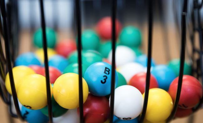 Close-up of colourful bingo balls in a black bingo cage