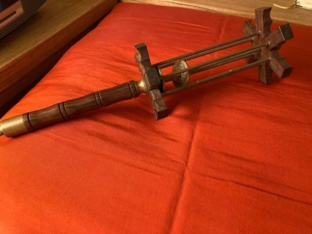 Wooden tool with a rotating part