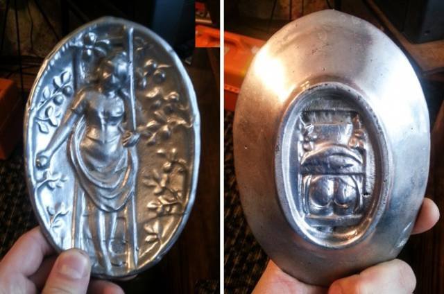 An ornate holder with an unusual illustration