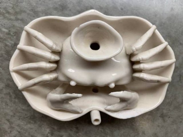 A ceramic crab with a small dish